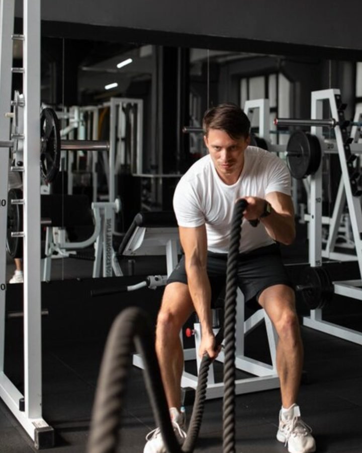 Man training with battle ropes